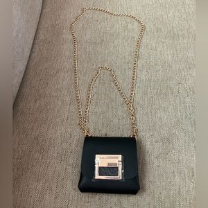 Black leather crossbody bag with gold chain
